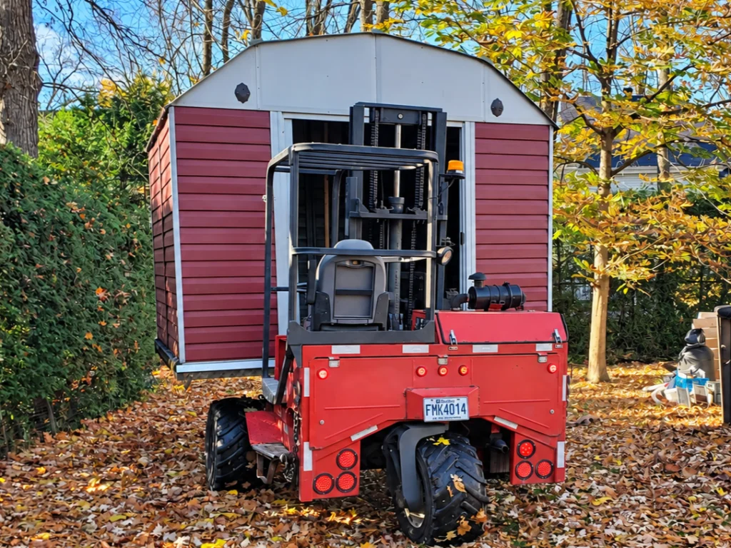 Red shed loaded for relocation by Transport JKM
